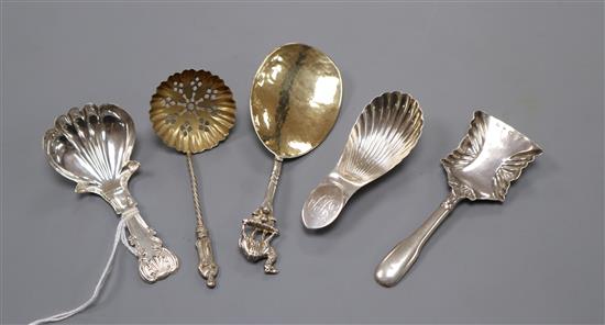 A George IV silver caddy spoons, John Bettridge, Birmingham, 1821, three other silver caddy spoons and a silver sifter spoon.